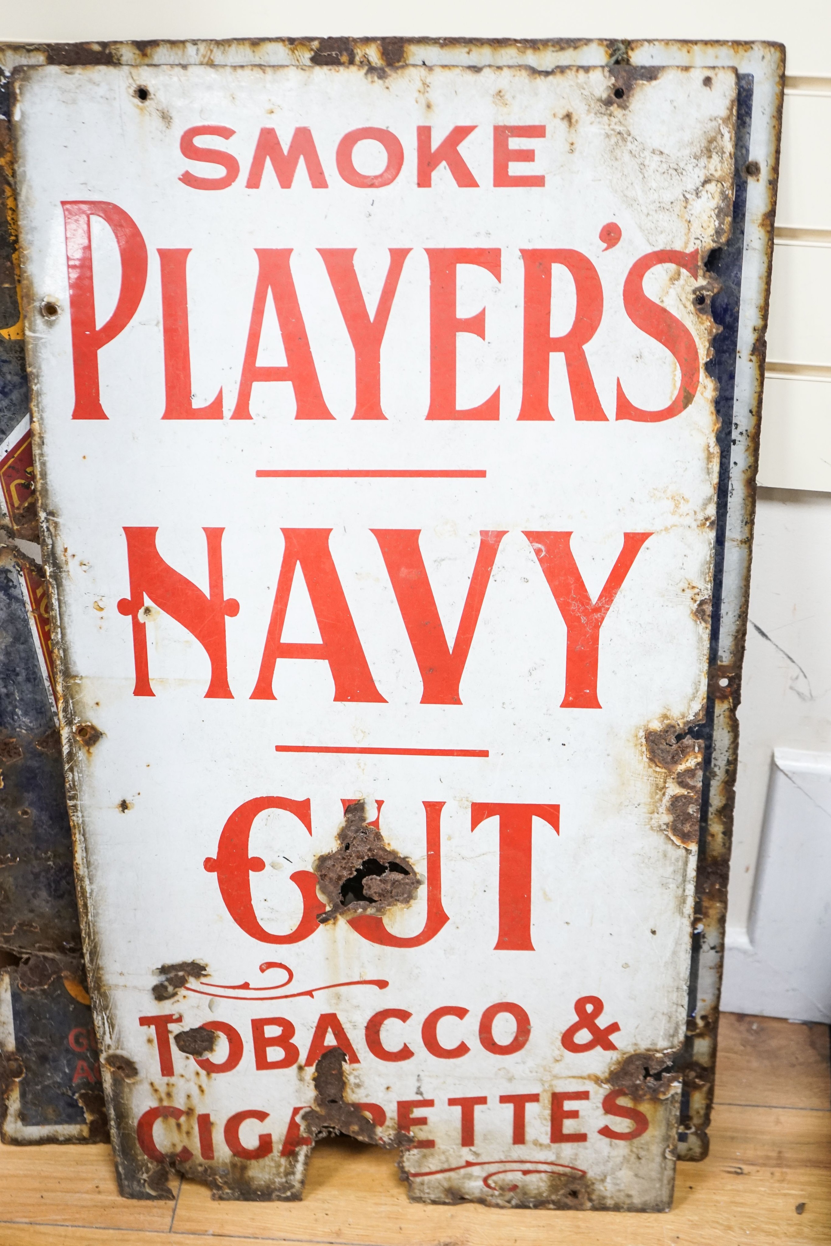 Three enamel advertising signs, one in poor condition, tallest 92cm
